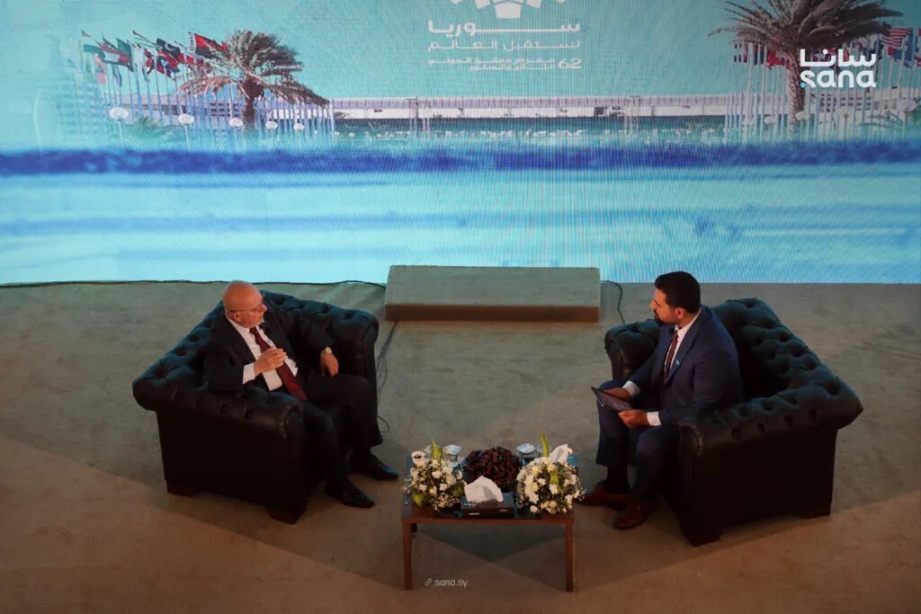 وزير الاقتصاد يدعو المستثمرين لخلق بيئة استثمارية جاذبة في سوريا بمعرض دمشق الدولي